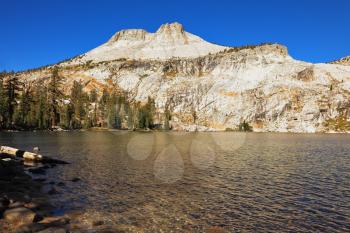 Early clear autumn morning. Picturesque transparent lake in mountains Yosemite of national park