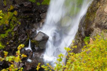 Picturesque waterfall Svartifoss in Skaftafell National Park of Iceland. Black stones in streams of water