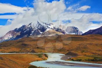 Beautiful Patagonia. Park Torres del Paine in southern Chile. Snow-capped mountains and emerald river