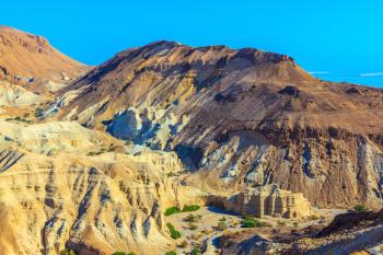  Picturesque multicolored sandstone dry talus. Ancient mountains in the valley of the Dead Sea