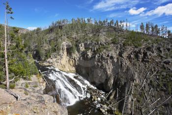 Rough stream of mineral water of river Gibbons in Yellowstone national park
