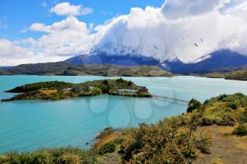 National Park Chile - Torres del Paine. Island Lake Pehoe and comfortable hotel. Easy bridge connects the hotel and the beach