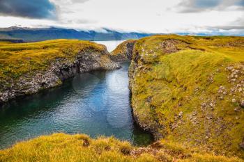 Iceland in July. The picturesque coastal bay near the fishing village of Arnastapi