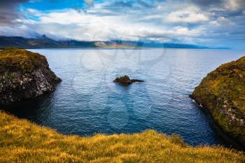 The picturesque coastal bay near the fishing village of Arnastapi. Iceland in summer