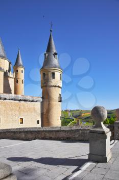 Ancient picturesque palace of the Spanish kings in Segovia and rural fields