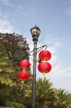 The usual lamppost decorated by beautiful red lanterns in the Chinese style