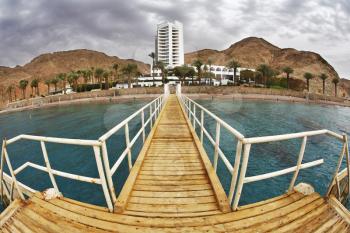 The wooden pier on a beach of Red sea in Eilat