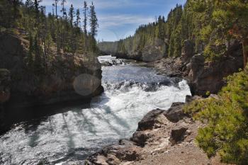 Beautiful falls on rough northern river in a wood