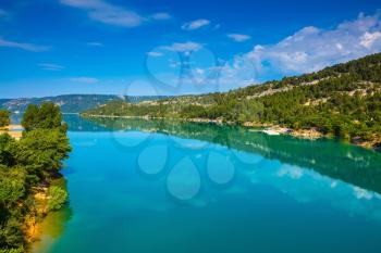 Verdon Canyon, the biggest in the French Alps. Spring Provence. Azure water reflects the clouds