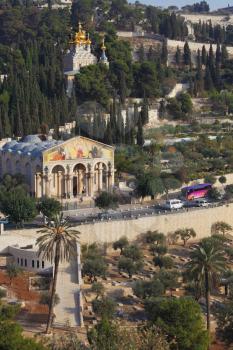 Mount of Olives in Jerusalem. All Saints Church, the road and centuries-old cypress trees
