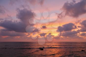 Magnificent sunset on Mediterranean sea. Clouds and reflexions on water