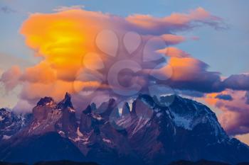 Incredible sunset in the  park Torres del Paine, Chile. Sharp curved  rocks Los Quernos