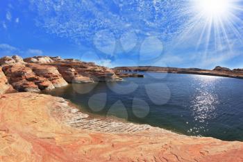 Photo taken fisheye lens. Midday heat. The artificial Lake Powell in the red desert of California.  
