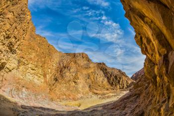 Picturesque and multi-color Black canyon in ancient Eilat mountains. Israeli warm winter. Photo taken fisheye lens