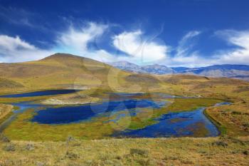 National Park Torres del Paine. Dreamland Patagonia. Blue water grassy lake, 