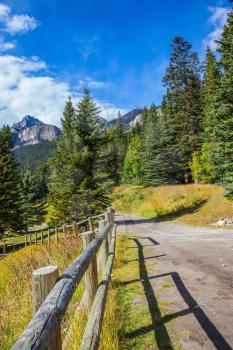 Canada, Rocky Mountains, Banff National Park.  Low wooden fence on the shore of Lake Louise