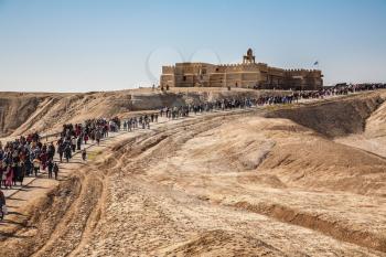  THE BORDER WITH JORDAN, ISRAEL - JANUARY 18, 2008:  The Day of the Christian feast of the Epiphany. Next to the road on which pilgrims go, stands the monastery of St. John  Baptist