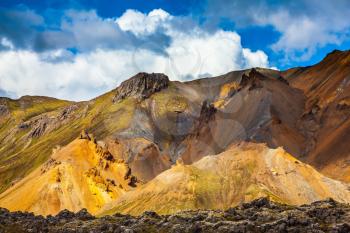  Multicolored rhyolite mountains highlights the July sun. Travel to Iceland in the summer. National Park Landmannalaugar