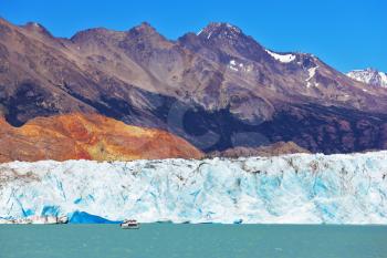 Excursion by boat to the huge white-blue glacier. Unique lake Viedma in Argentine Patagonia. The lake is surrounded by mountains
