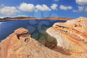 Midday heat. The artificial Lake Powell in the red desert of California.  Photo taken fisheye lens
