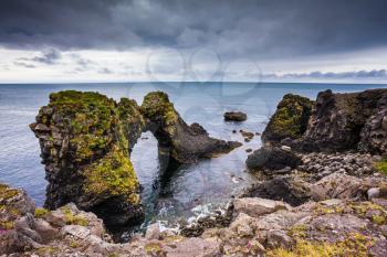 Picturesque coastal cliffs Arnastapi. Travel to Iceland in the summer