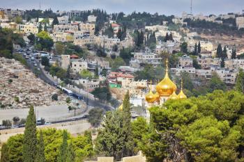  Golden domes of an Orthodox church of Mary Magdalene. Ancient holy Jerusalem from the Mount of Olives