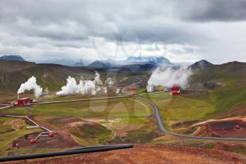 Krafla Lake neighborhood. Summer Iceland. Steam rises above the hot ground