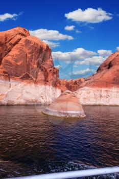 Walk on the tourist boat.  Red sandstone hills surround the lake. Lake Powell on the Colorado River