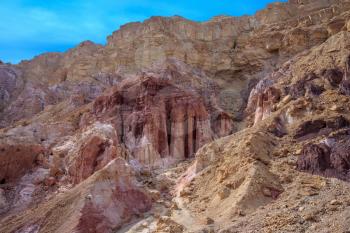 Gorge in the dry mountains of Eilat and natural Amram pillars of pink sandstone. Warm January day in Israel
