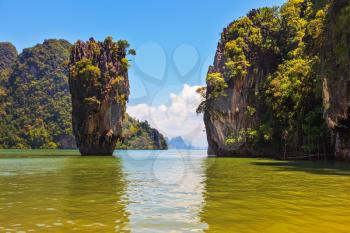 The tourist season in Thailand. Calm and warm sea and picturesque quaint island. James Bond Island