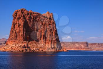  Lake Powell is surrounded by magnificent sandstone hills. Boat trip on a sunny day. Scenic huge artificial water basin of the Colorado River, USA