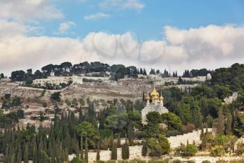Golden domes of Orthodox church of Mary Magdalene. Ancient holy Jerusalem from the Mount of Olives