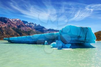 Lake Viedma, Argentine Patagonia.  Huge white-blue iceberg floating in the warm summer sun