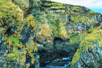Gorgeous Iceland. North sea coast. Scenic fjords on a cloudy summer day. Rocks covered with moss