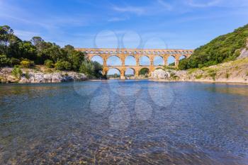 Provence, spring sunny day. Three-tiered aqueduct Pont du Gard - the highest in Europe. The bridge was built in Roman times on  river Gardon