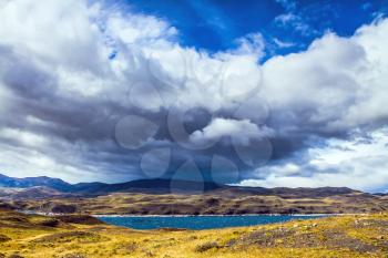  Scary black clouds over the Chilean Patagonia. National Park Torres del Paine, Chile. The concept of active and extreme tourism