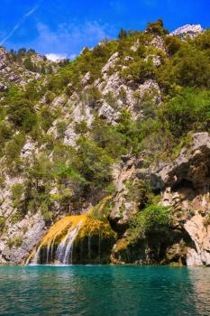 The picturesque azure waterfall on the side wall of canyon Verdon. National park Merkantur, Provence, France