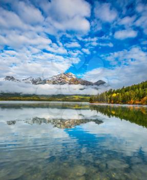 The Pyramids Lake in Canadian Rockies. Cold autumn morning. Concept  of vacation and tourism