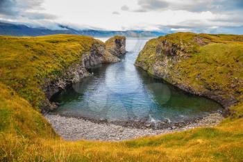 The picturesque coastal bay near the fishing village of Arnastapi. Iceland in July