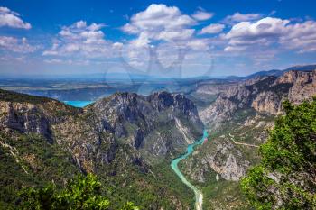 The largest alpine canyon Verdon spring. Turquoise water of the river is flowing at the bottom of the gorge. Canyon of Verdon, Provence