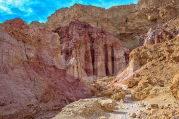  Warm January day in Israel. Gorge in the dry mountains of Eilat and natural Amram pillars of pink sandstone