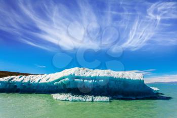 The huge white-blue iceberg floats under the warm summer sun. Argentina Patagonia, Vyedm's lake