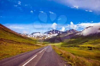 The concept of extreme northern tourism. Summer tour in the Nordic countries. The Iceland  highway in Tundra