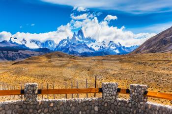 Desert and mountains. The famous ridge Mount Fitz Roy and the Patagonian pampas. Argentine Patagonia. The concept of active and extreme tourism