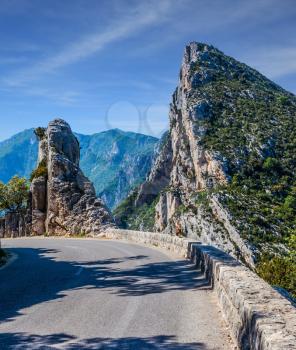 Picturesque and dangerous mountain road in the French Alps, Provence. The fascinating journey to the canyon in Europe - Verdon. Concept of ecological, extreme and active tourism  