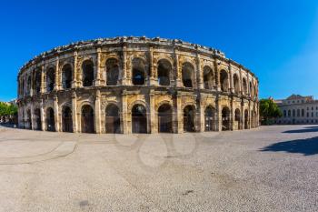 Roman amphitheater in Nimes, Provence. Magnificent huge arena perfectly preserved for two thousand years. Photo taken fisheye lens
