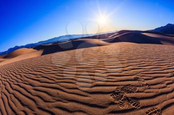  Bright solar morning in picturesque part of Death Valley, USA. Mesquite Flat Sand Dunes, Stovepipe Wells Village. Thin waves on sand