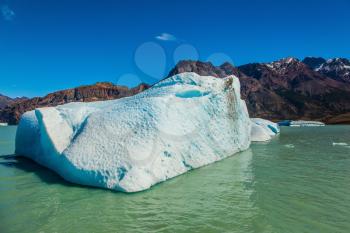 Argentina Patagonia, Lake Viedma. The huge white-blue iceberg drifts from coastal glacier in warm summer day