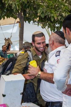 JERUSALEM, ISRAEL - OCTOBER 8, 2014: Sukkot in Israel. Traditional festive market in Jerusalem. Jews buy four ritual plants