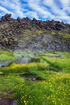  Lake with hot water on the source of thermal water. Sunrise Park Landmannalaugar. White nights in Iceland